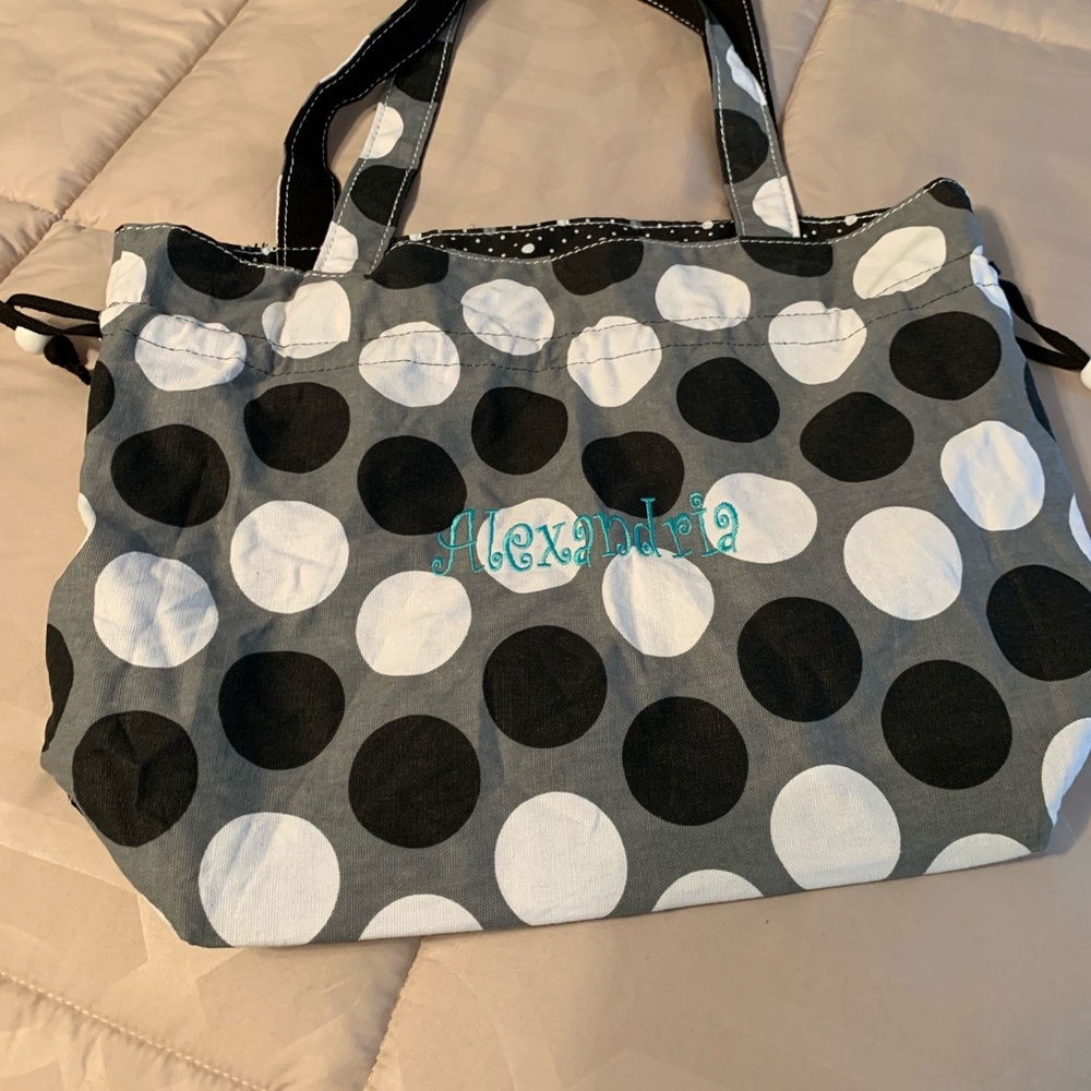Black polka dot monogram bag